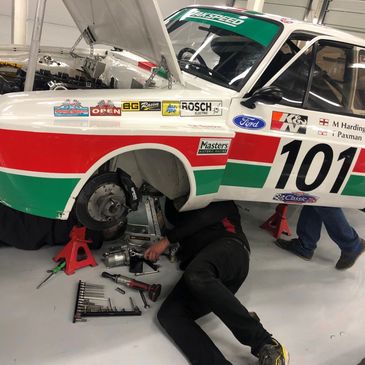 Man working on Zakspeed Escort Race Car 